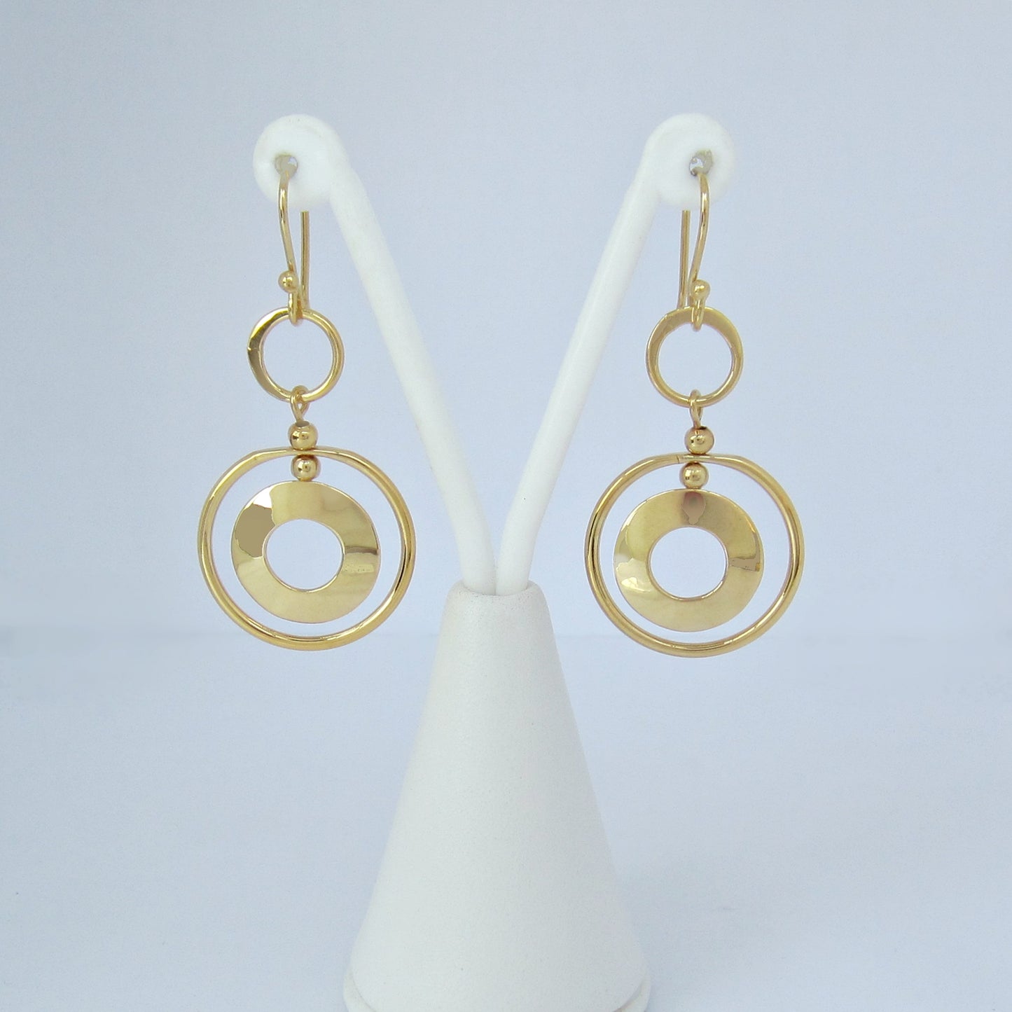 Arete Dorado Círculos en Movimiento