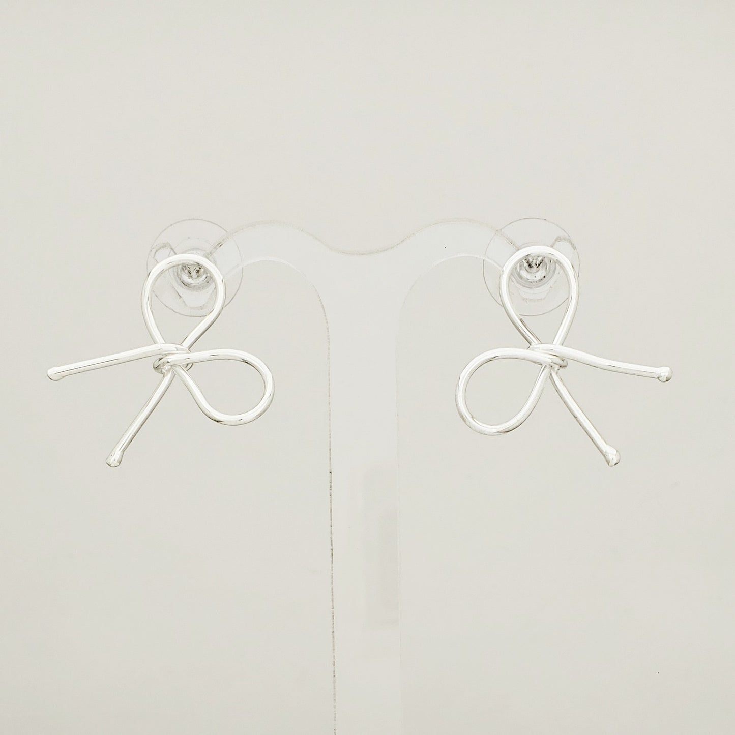 Aretes Plateado Moño Coquette