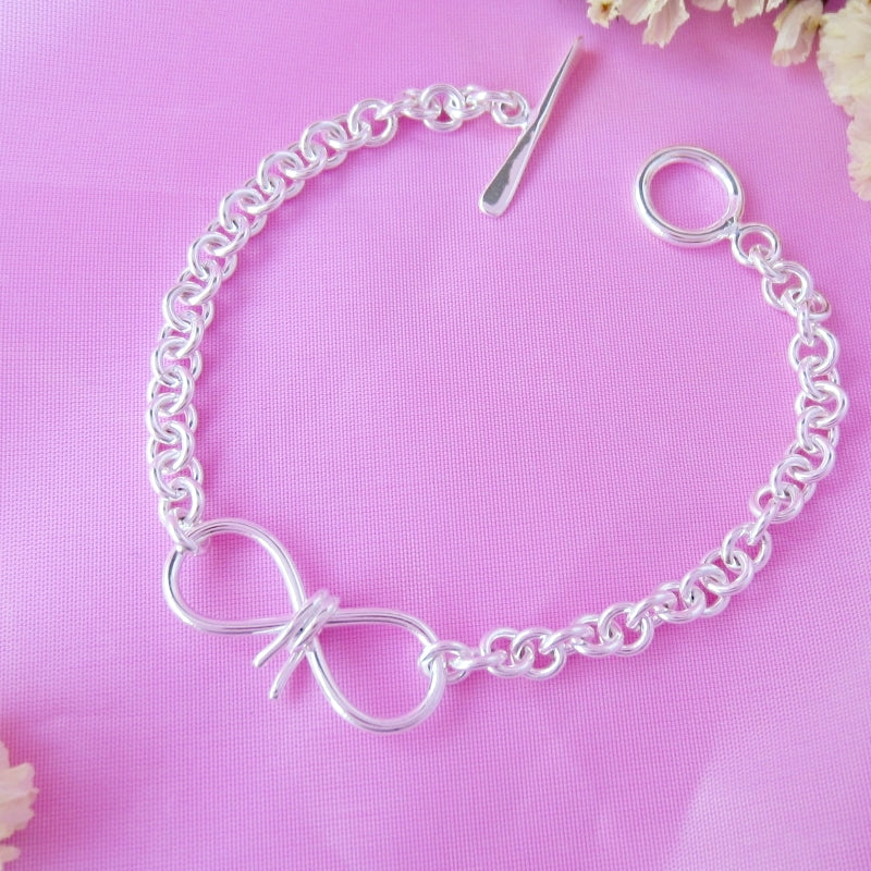 Pulsera plateada moñito