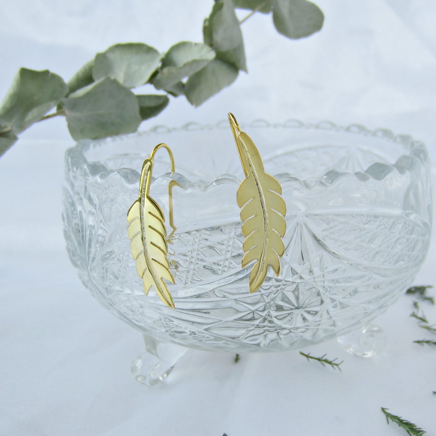 Aretes dorados pluma india