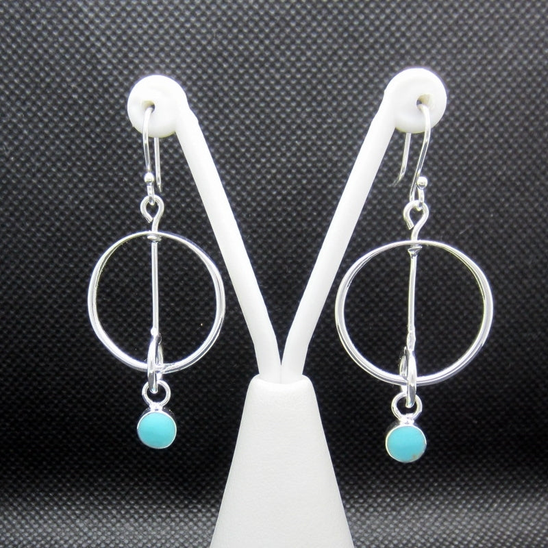 Silver hoop earrings in synchrony