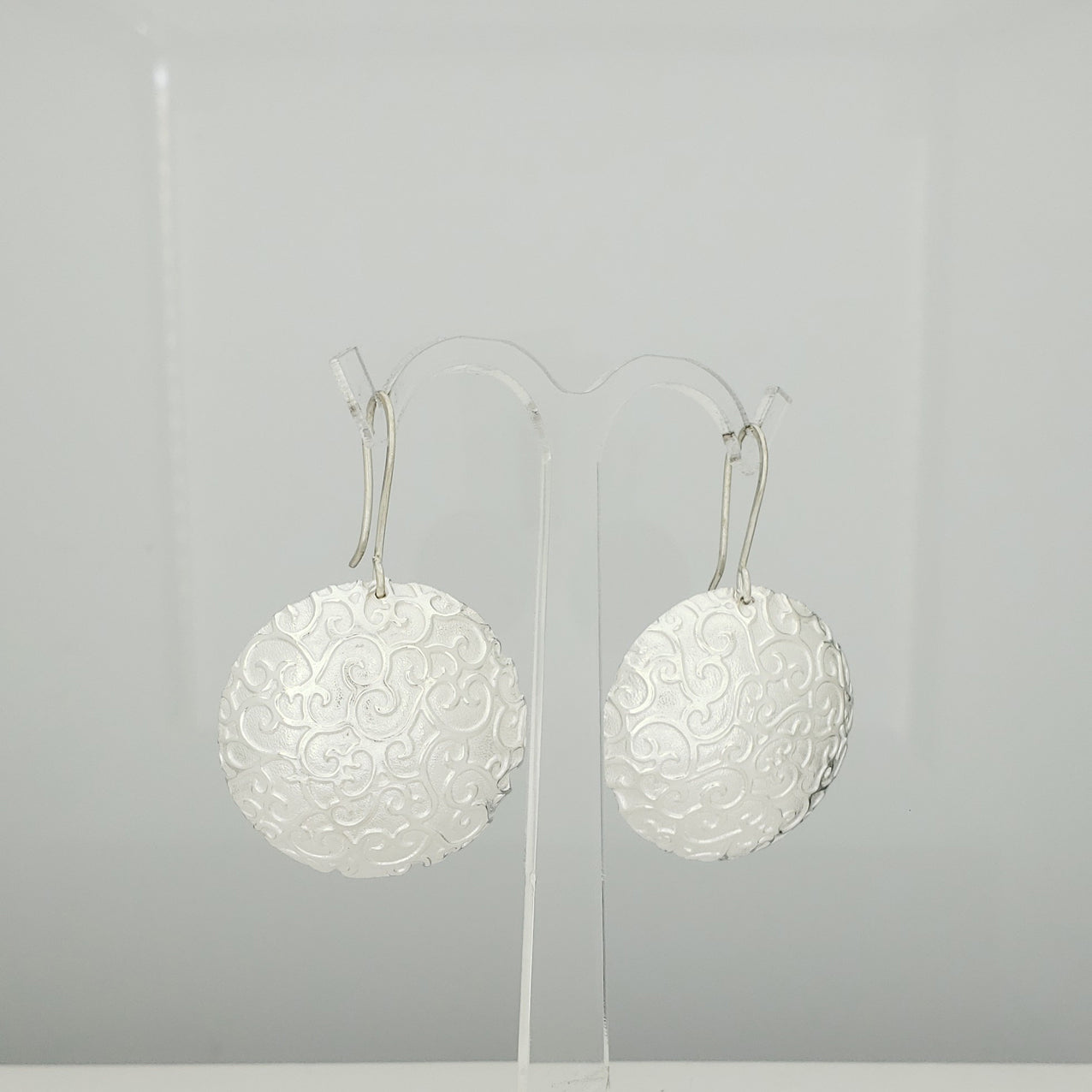 Arete plateado cazuela chinos