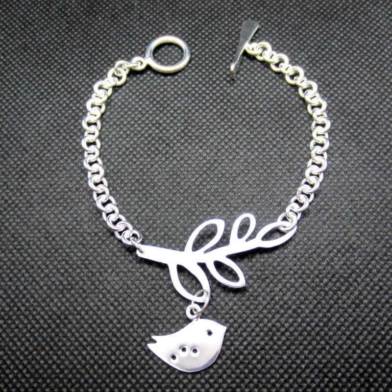 Pulsera plateada rama y pajarito