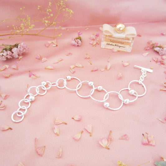 Pulsera plateado argollas sencillas bolitas