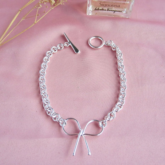 Pulsera plateada moñito