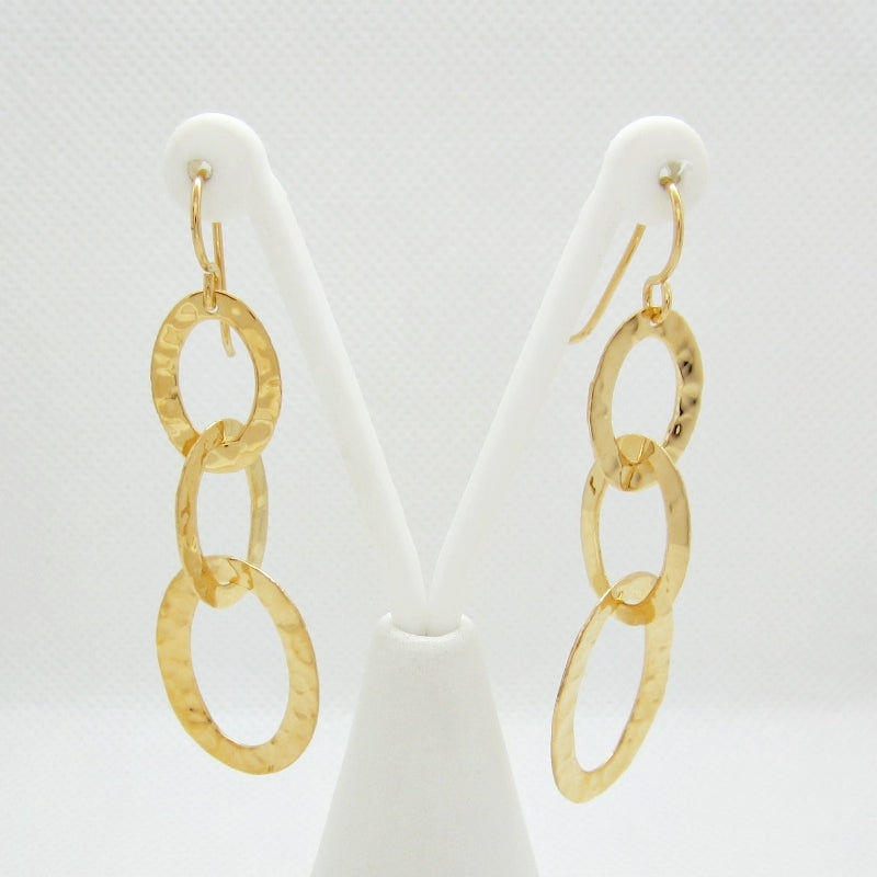 Three oval earrings