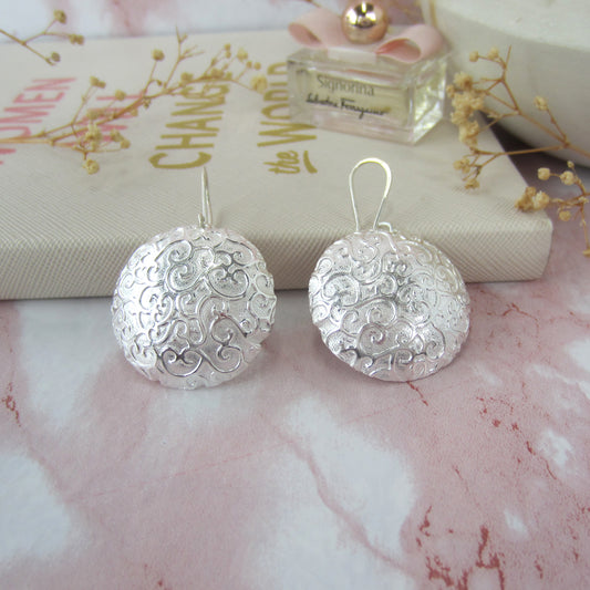 Arete plateado cazuela chinos