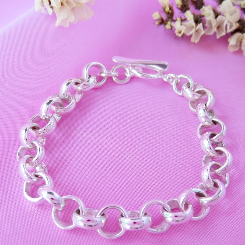 Pulsera plateada aritos