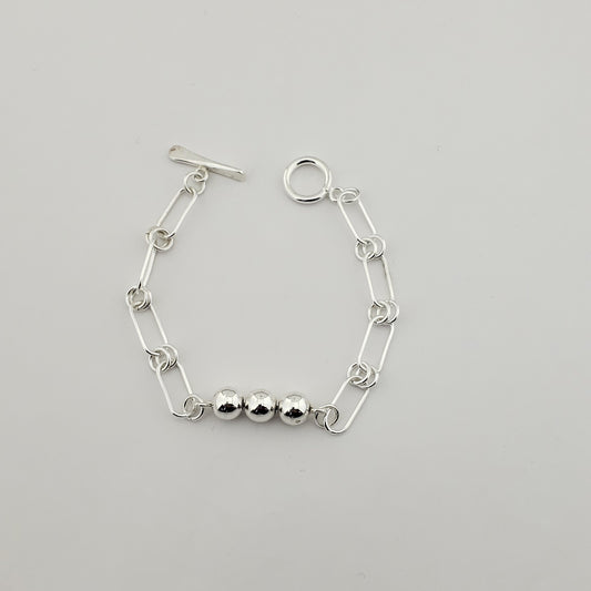 Pulsera plateada bolitas